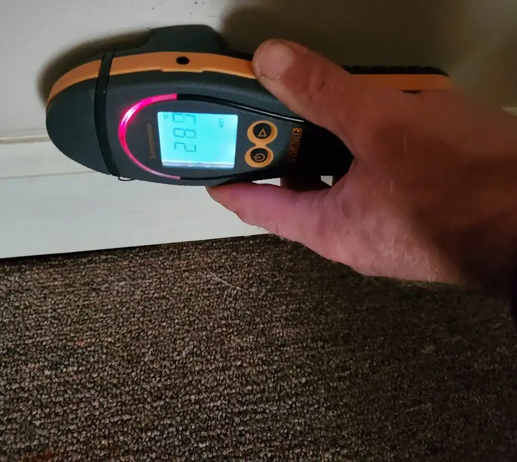 Moisture detection at baseboard during Storm Damage Restoration in Grantsville